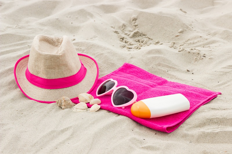 Accessories for vacation on sand at beach, sun protection and summer time concept